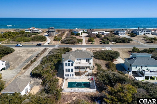 bird's eye view featuring a water view and a residential view