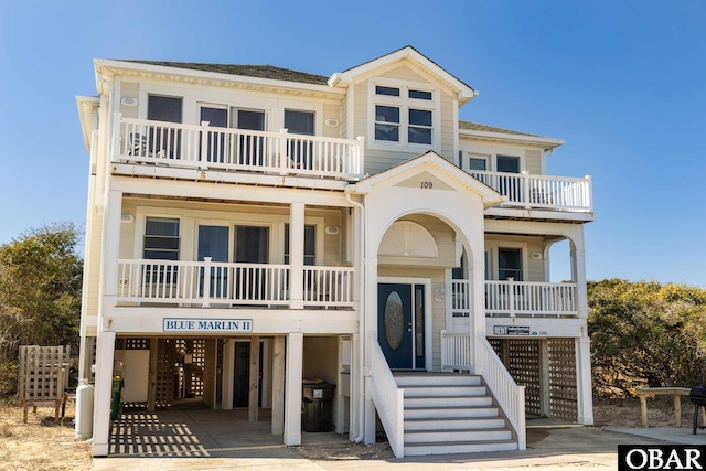 beach home featuring a carport and driveway