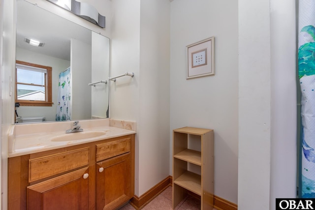 bathroom with tile patterned flooring, toilet, visible vents, vanity, and baseboards