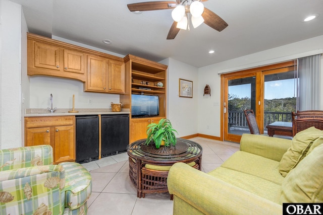 living area featuring light tile patterned flooring, recessed lighting, a ceiling fan, baseboards, and wet bar