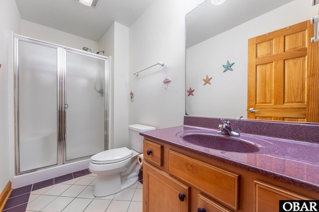 full bathroom featuring toilet, tile patterned flooring, vanity, and a shower stall