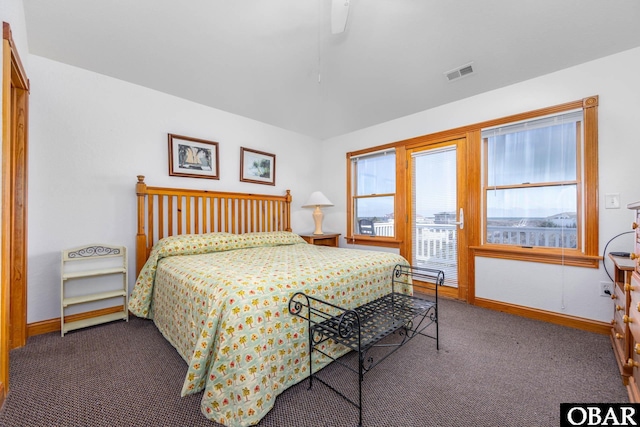 bedroom featuring ceiling fan, dark carpet, visible vents, and baseboards