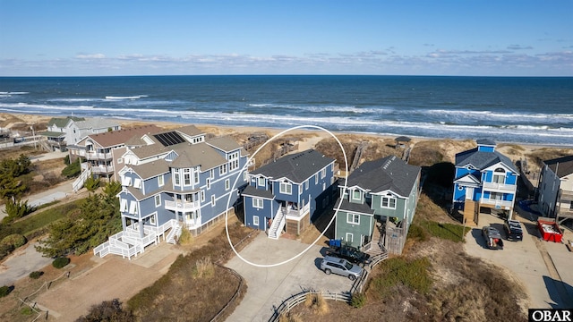 bird's eye view with a water view and a residential view