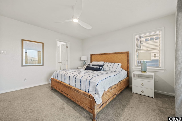 bedroom featuring carpet, ceiling fan, baseboards, and ensuite bathroom