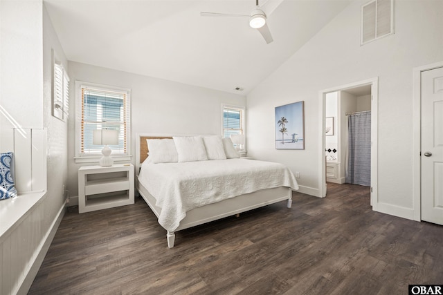 bedroom featuring dark wood-style floors, visible vents, connected bathroom, high vaulted ceiling, and baseboards