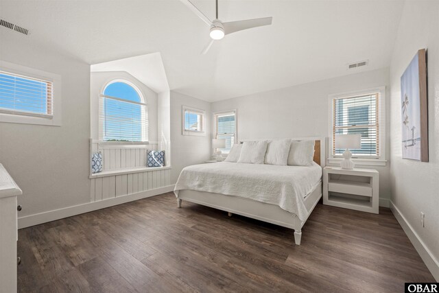 bedroom with dark wood-type flooring, visible vents, baseboards, and a ceiling fan