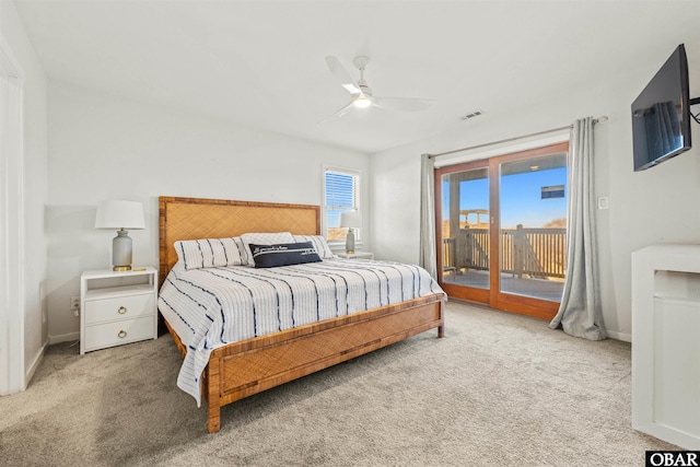 carpeted bedroom featuring a ceiling fan, access to outside, visible vents, and baseboards