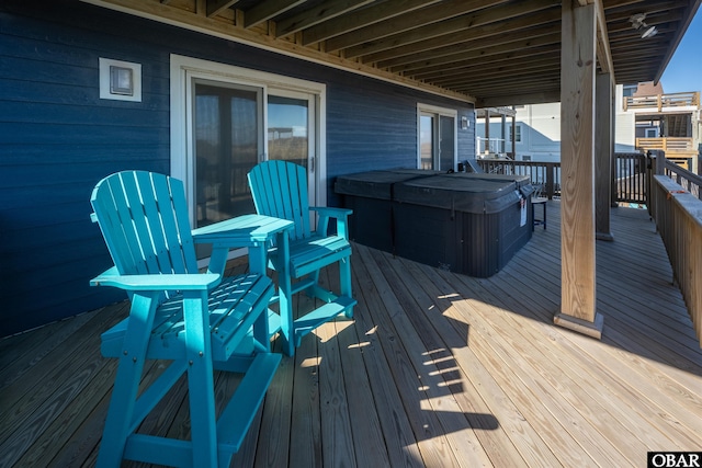 wooden terrace with a hot tub