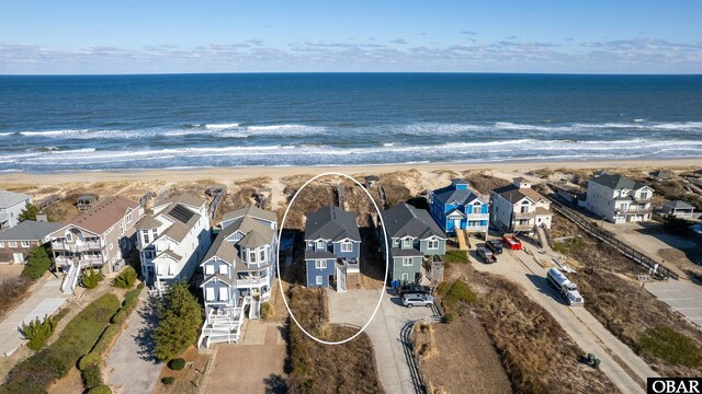 bird's eye view with a water view and a residential view