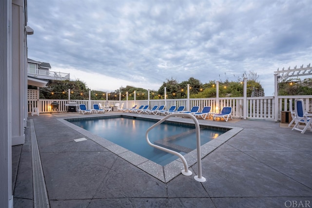 pool with fence, a patio, and a pergola