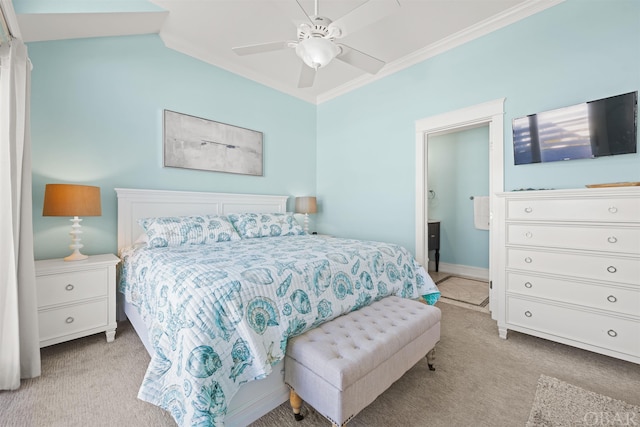 bedroom featuring ceiling fan, ornamental molding, ensuite bathroom, and light colored carpet