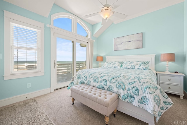 bedroom with access to exterior, carpet, multiple windows, and baseboards