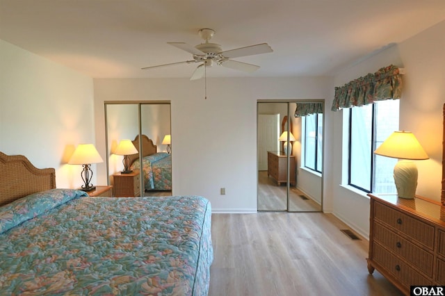 1006 Swordfish Way Unit 1006, Kitty Hawk, NC 27949 - bedroom featuring multiple closets, wood finished floors, ceiling fan, and baseboards