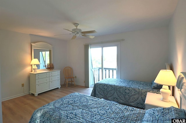 1006 Swordfish Way Unit 1006, Kitty Hawk, NC 27949 - bedroom with multiple windows, wood finished floors, baseboards, and a ceiling fan