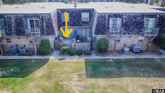 1006 Swordfish Way Unit 1006, Kitty Hawk, NC 27949 - multi unit property featuring brick siding, central AC unit, and a chimney