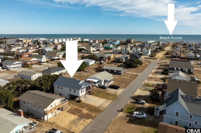 bird's eye view featuring a water view and a residential view