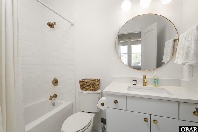 bathroom with toilet, vanity, and bathing tub / shower combination