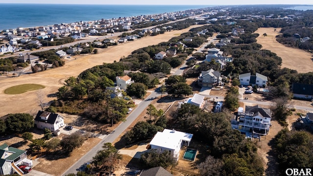 bird's eye view with a water view and a residential view