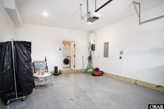 garage featuring a garage door opener, washer / clothes dryer, electric panel, and water heater