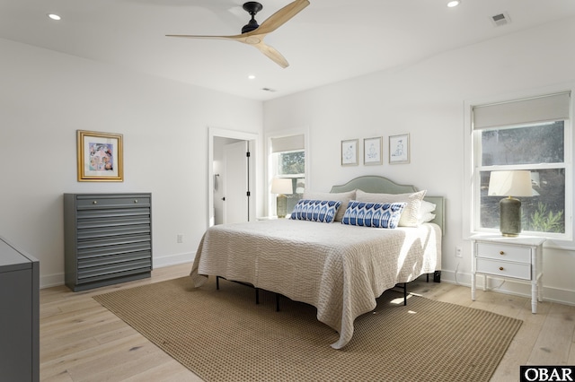 bedroom with visible vents, baseboards, light wood-style flooring, ceiling fan, and recessed lighting