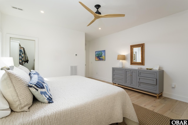 bedroom featuring light wood-style flooring, visible vents, and recessed lighting