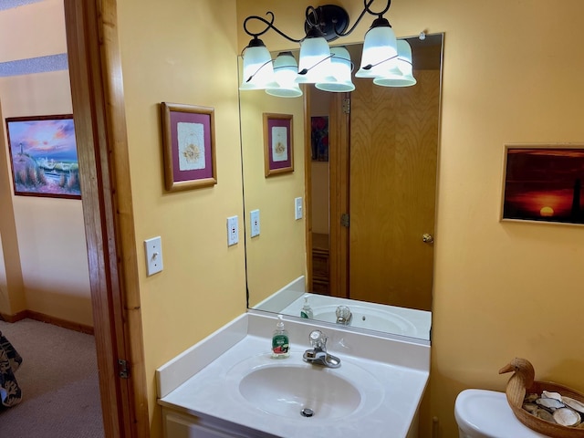 half bath with vanity and toilet