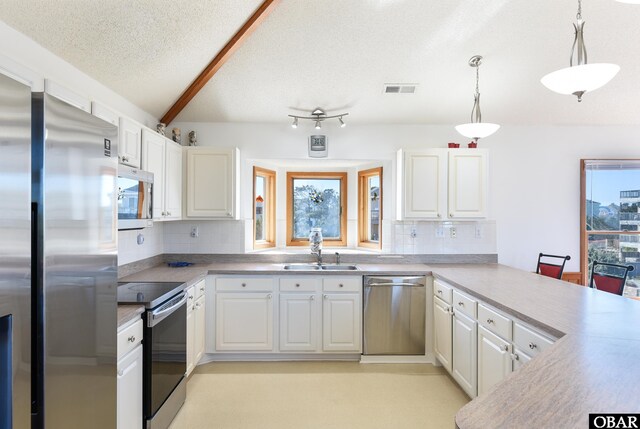 dining area featuring visible vents, light wood-style flooring, wood walls, vaulted ceiling, and ceiling fan with notable chandelier