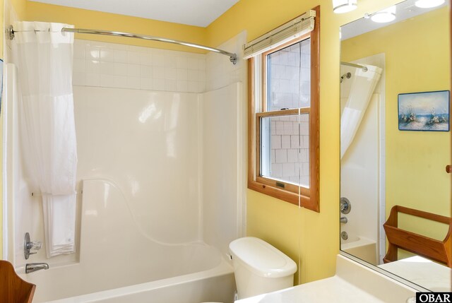 bathroom with shower / bath combination with curtain