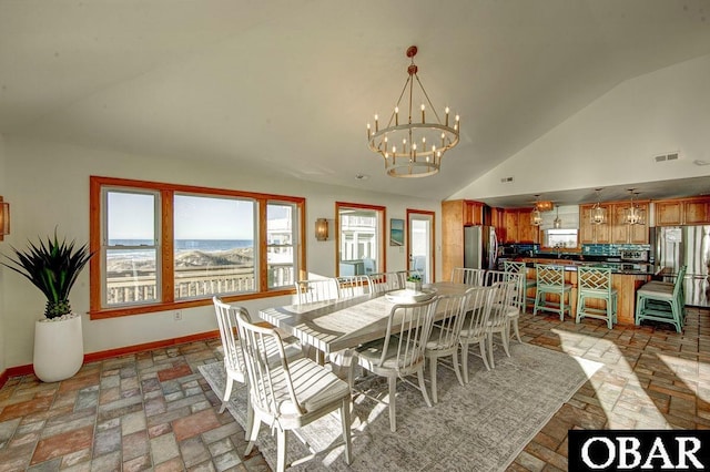 57236 Atlantic View Dr Lot 3, Hatteras, NC 27943 - dining area with vaulted ceiling, a chandelier, baseboards, and brick patterned flooring