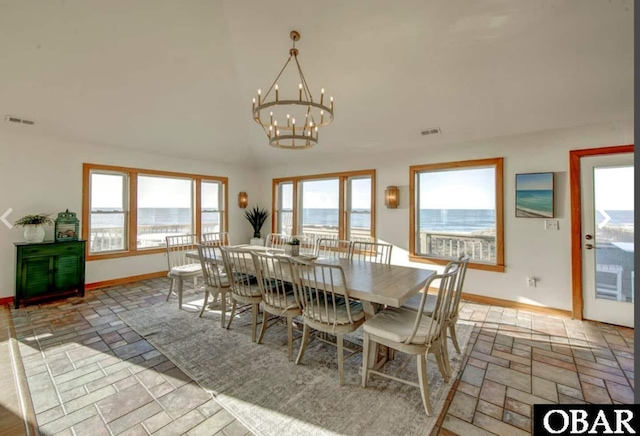 57236 Atlantic View Dr Lot 3, Hatteras, NC 27943 - dining room with baseboards, a chandelier, plenty of natural light, and stone tile flooring