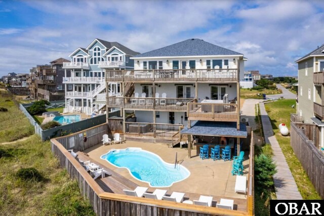 57236 Atlantic View Dr Lot 3, Hatteras, NC 27943 - rear view of property with a deck, a fenced backyard, and a patio