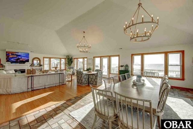 57236 Atlantic View Dr Lot 3, Hatteras, NC 27943 - dining area featuring a chandelier and high vaulted ceiling