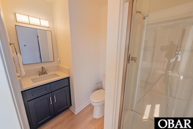804 S Memorial Blvd Unit 3-D, Kill Devil Hills, NC 27948 - full bathroom featuring toilet, a stall shower, wood finished floors, vanity, and baseboards