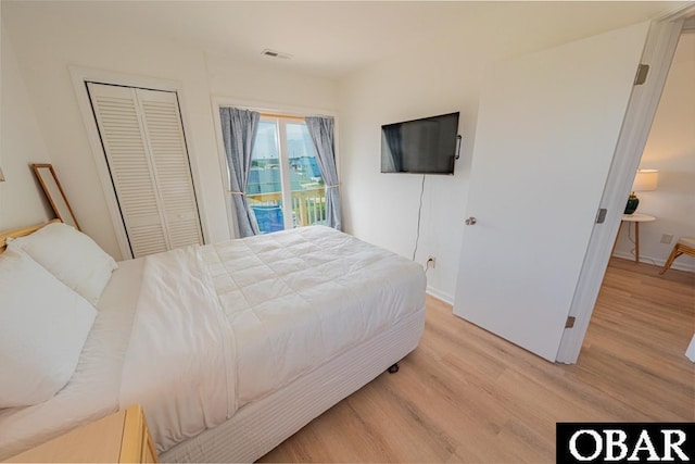 804 S Memorial Blvd Unit 3-D, Kill Devil Hills, NC 27948 - bedroom with light wood-style flooring, access to outside, baseboards, and a closet