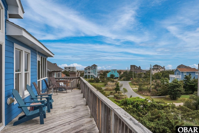 wooden terrace featuring a residential view