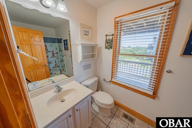bathroom with a shower with shower curtain, vanity, tile patterned floors, toilet, and visible vents