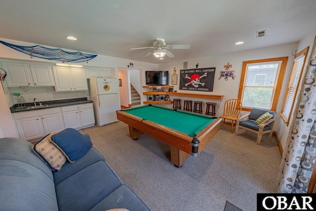 game room with billiards, a ceiling fan, visible vents, a sink, and light colored carpet