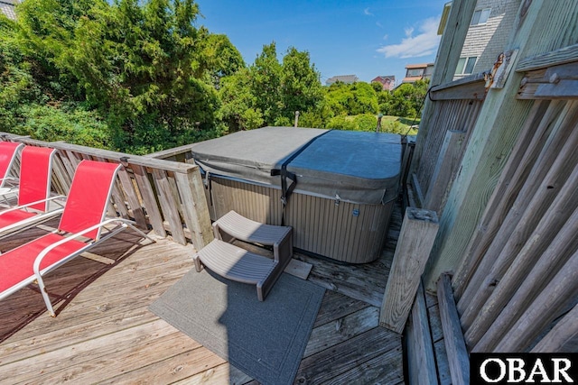 deck featuring a hot tub