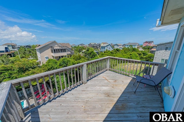 wooden terrace with a residential view