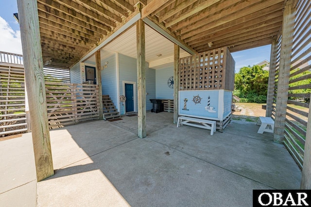 view of patio / terrace featuring stairway