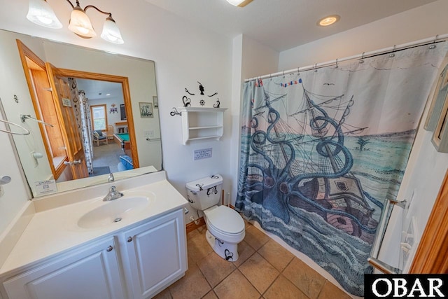 bathroom featuring tile patterned floors, toilet, vanity, and a shower with curtain