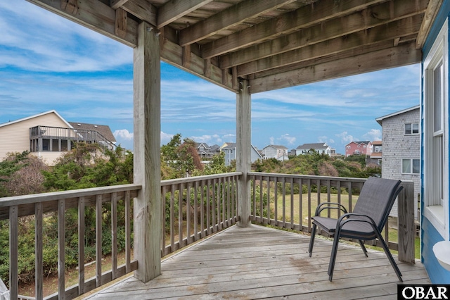 wooden terrace featuring a residential view