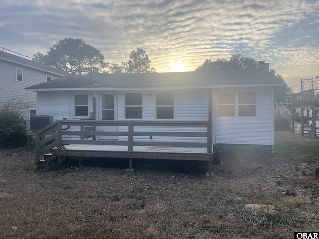 back of property featuring a wooden deck