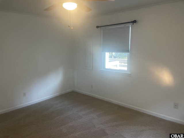 unfurnished room featuring carpet floors, ceiling fan, and baseboards