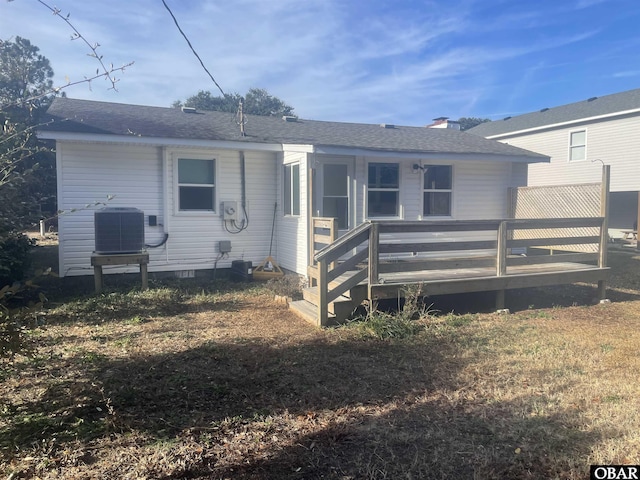 rear view of property featuring a deck, central AC, crawl space, and roof with shingles