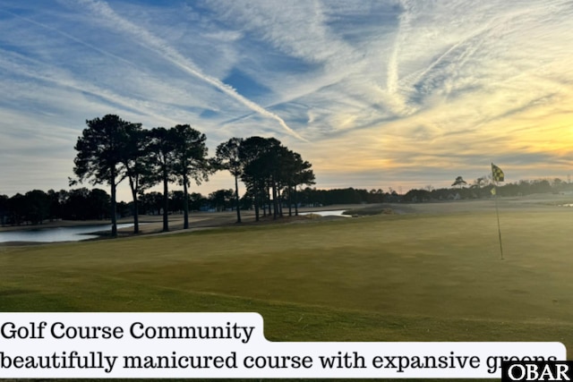 172 Charleston Dr Lot 163, Grandy, NC 27939 - surrounding community with view of golf course, an area to practice putting, and a water view
