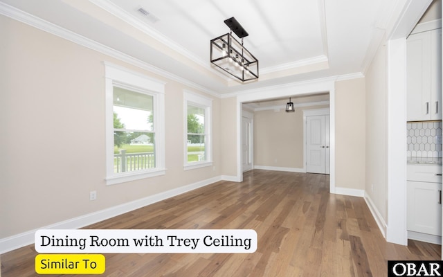 172 Charleston Dr Lot 163, Grandy, NC 27939 - unfurnished dining area featuring light wood-style flooring, crown molding, a chandelier, and a raised ceiling