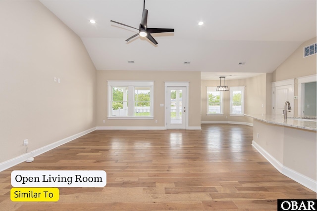 172 Charleston Dr Lot 163, Grandy, NC 27939 - unfurnished living room with vaulted ceiling, light wood finished floors, healthy amount of natural light, ceiling fan, and recessed lighting