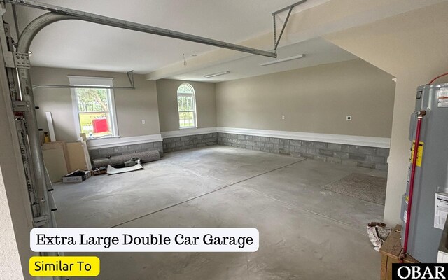 172 Charleston Dr Lot 163, Grandy, NC 27939 - garage featuring water heater and wainscoting