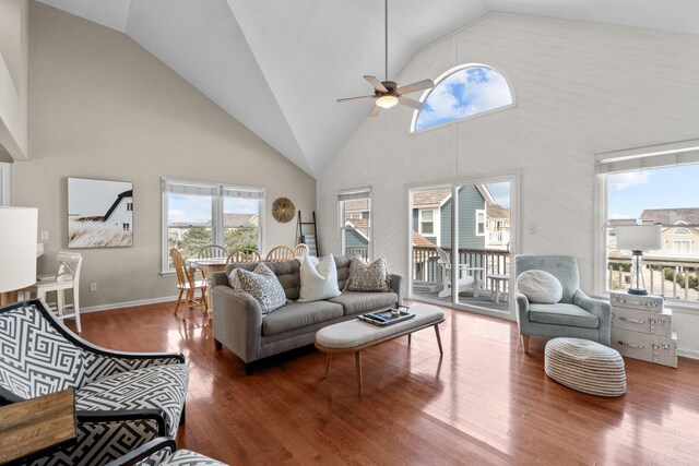 living room with high vaulted ceiling, ceiling fan, and wood finished floors